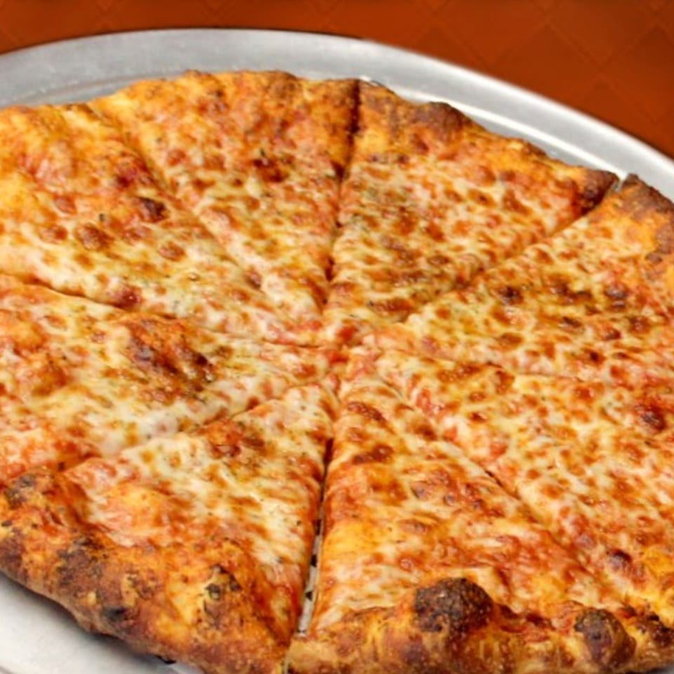 A whole Amelio's Pizza and More cheese pizza, cut into eight slices, on a metal pan.